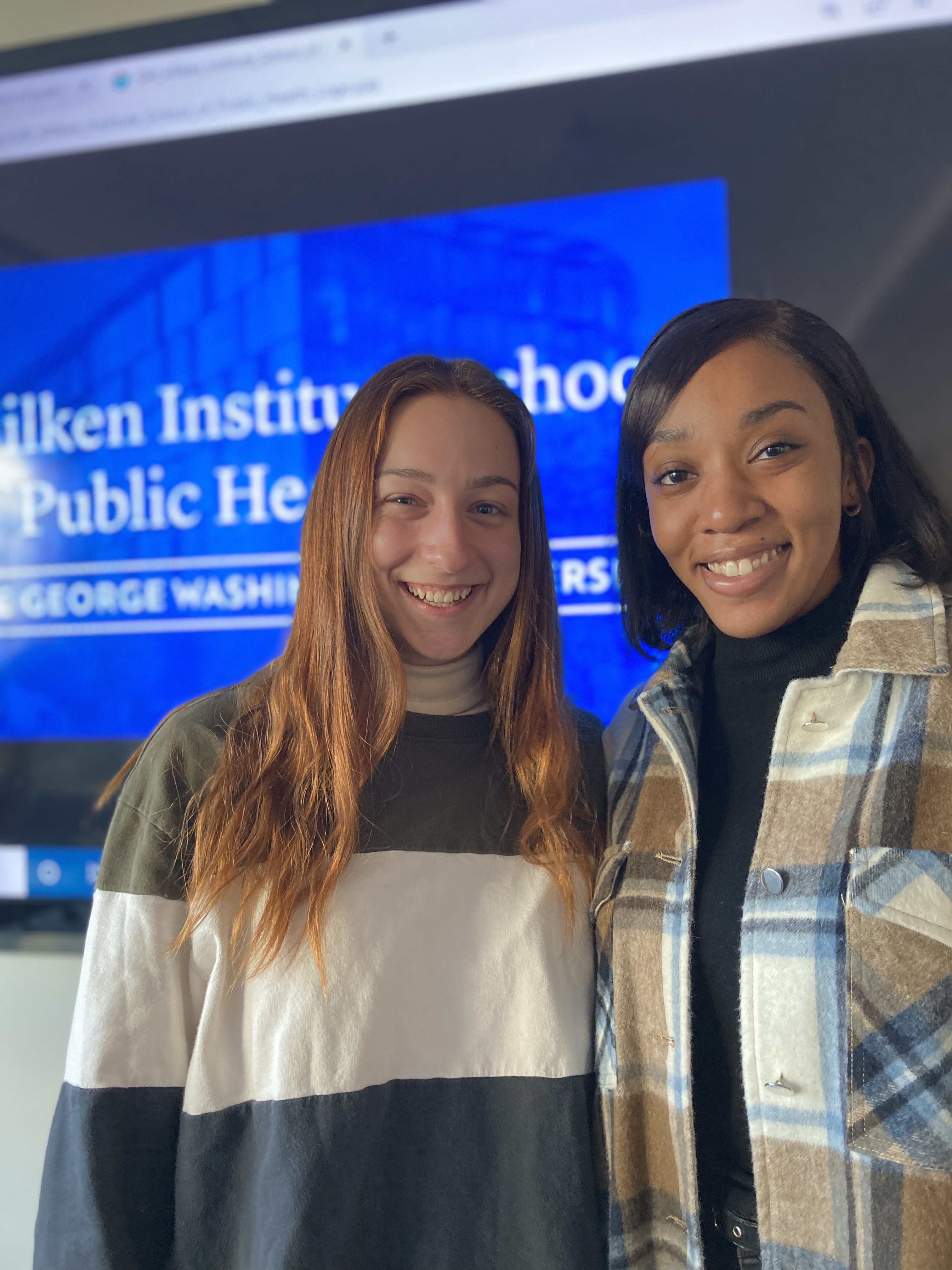 Current students standing together in classroom
